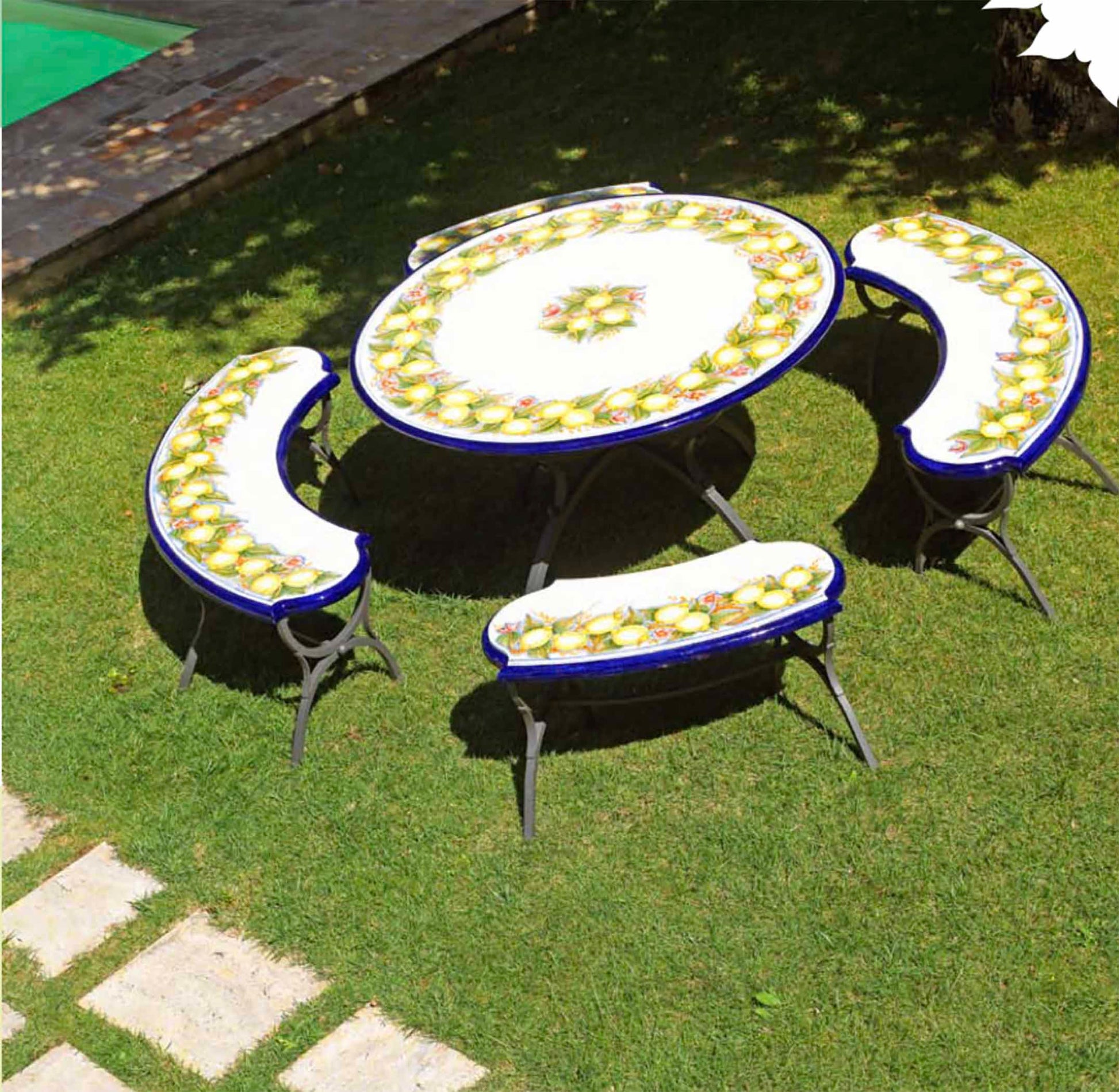 Italian hand-painted ceramic glazed round volcanic stone table and matching curved benches in Sorrento Limoneto design on a luxury garden