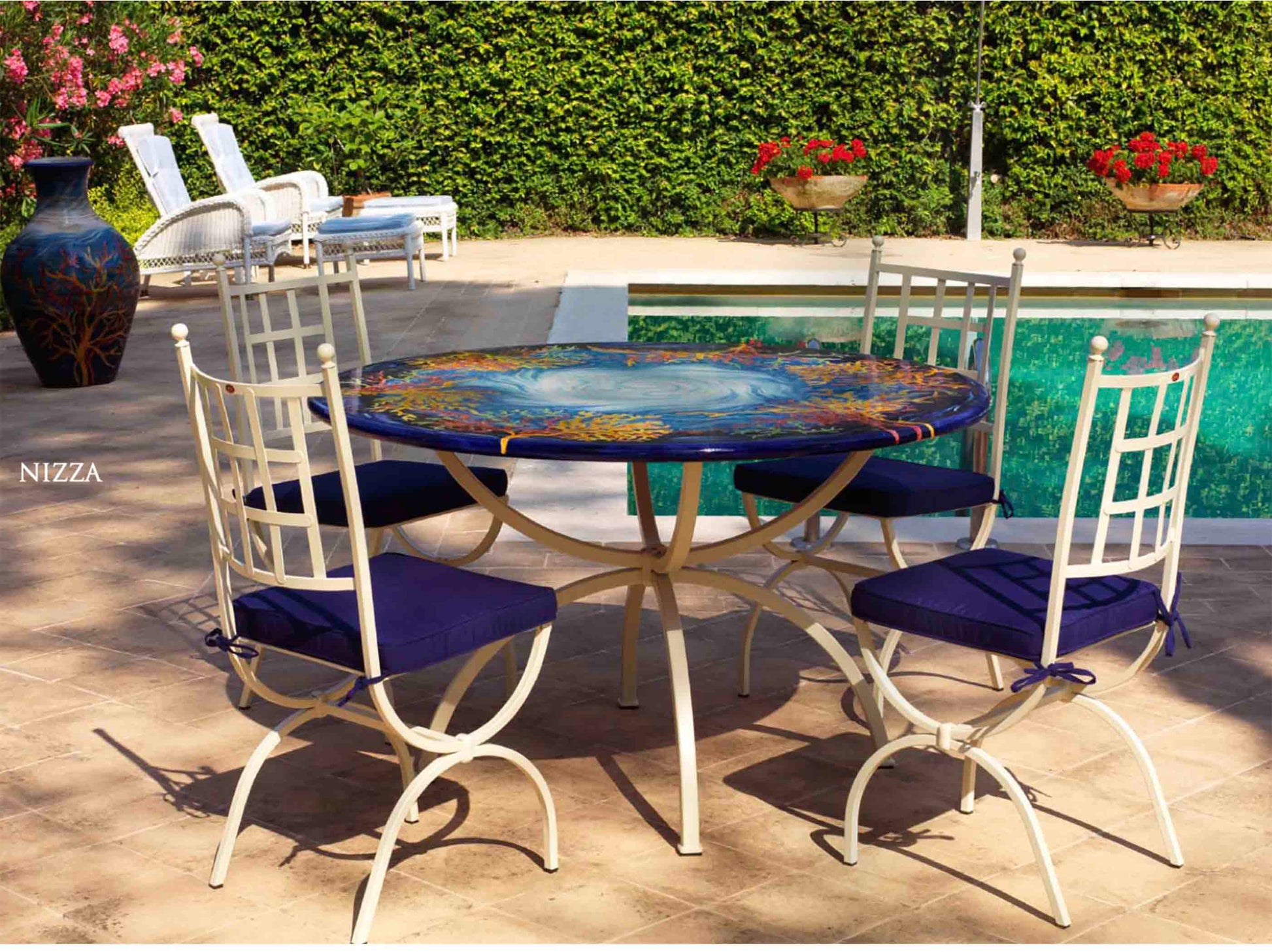 Italian hand-painted ceramic glazed round volcanic stone table in Panarea Oceanico swirling sea and coral reef design with a classic wrought iron base