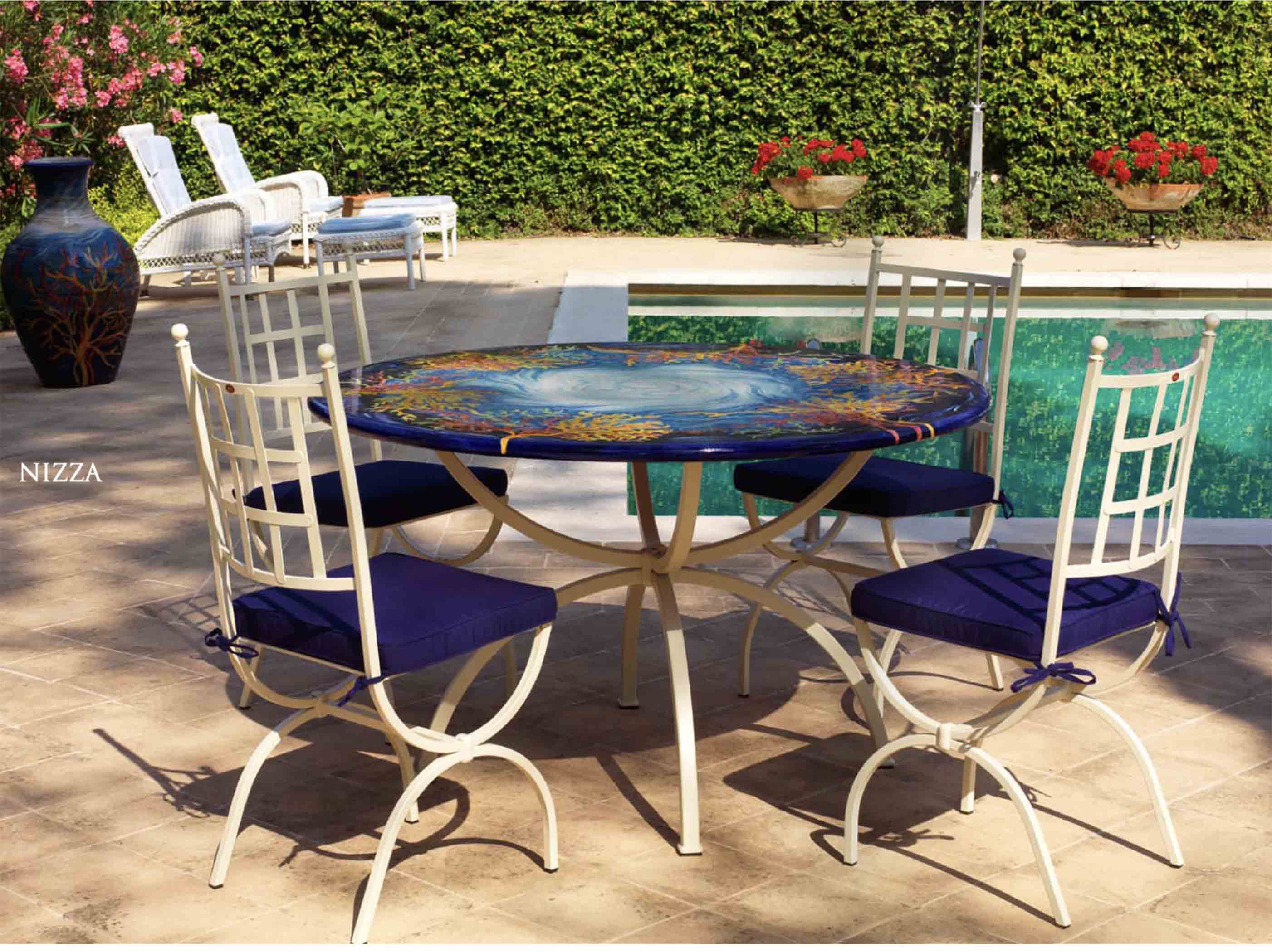 Italian hand-painted ceramic glazed round volcanic stone table in Panarea Oceanico swirling sea and coral reef design with a classic wrought iron base